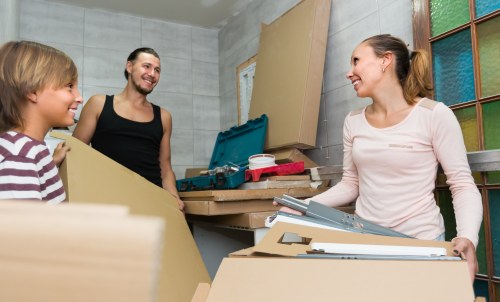 Removal team preparing a move in Marblearch with boxes and furniture