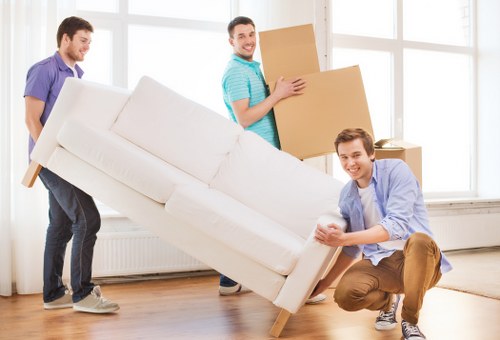 Careful loading of wrapped furniture for removals in Marblearch