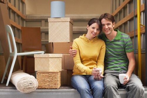 Trained removals staff handling furniture with care