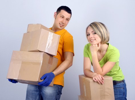 Packed office boxes and furniture ready for relocation in Marblearch