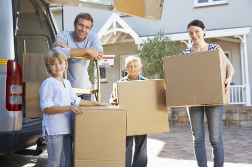 Packed moving boxes and furniture ready for collection in Marblearch