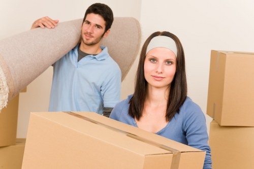 Mover assessing furniture volume for a cubic-yard removal estimate