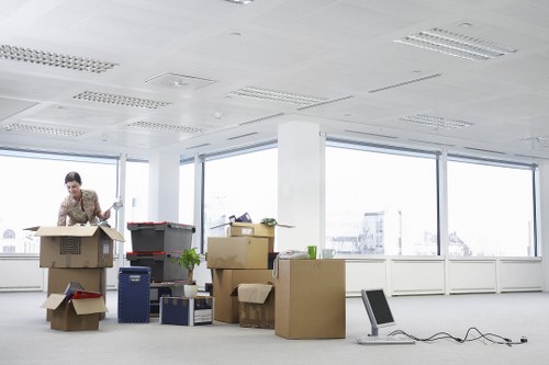 Office furniture being moved with a local removals van