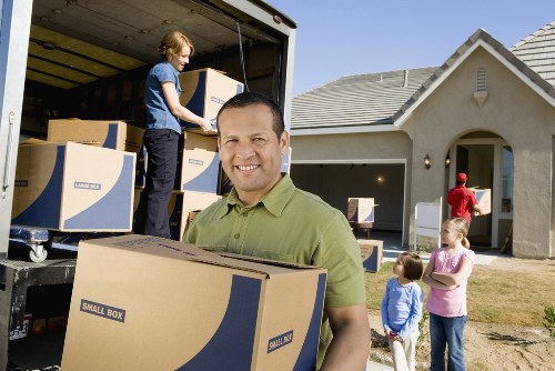 Professional movers handling furniture and boxes near Marblearch central London